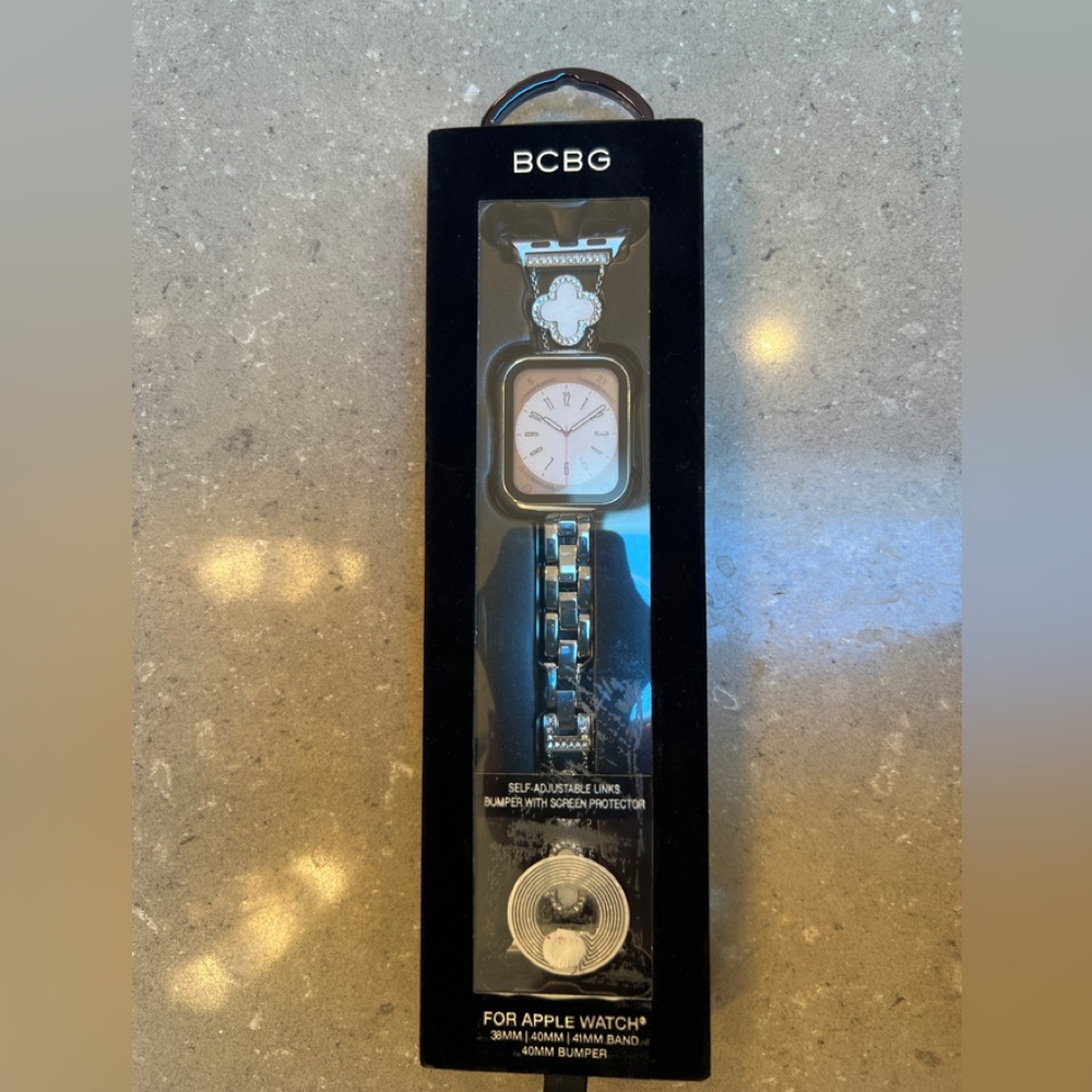 NWT BCBG Apple Watch Band: silver w clovers. Fun design! Fits models 38/40/41MM